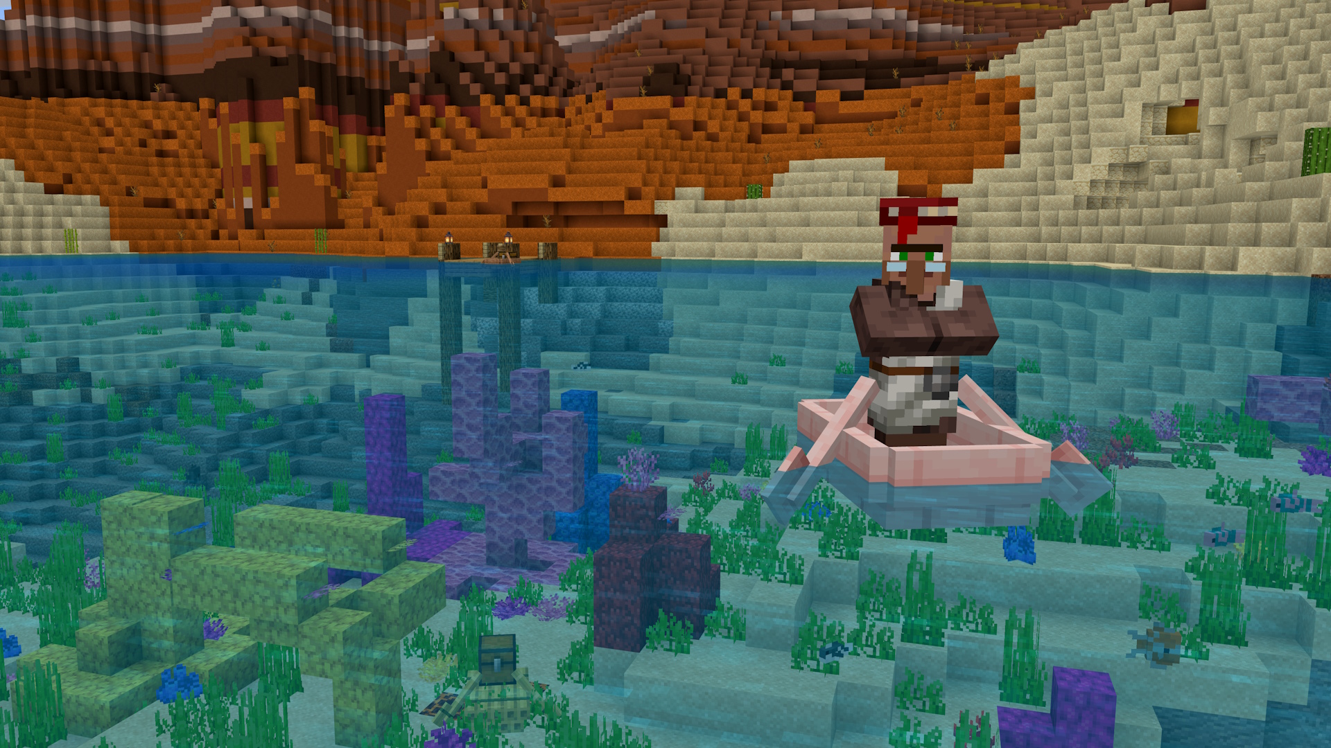 A Minecraft screenshot of a Villager in a cherry-wood boat, floating over a warm ocean biome, with a sunken chest boat below. There is a small jetty in the background.