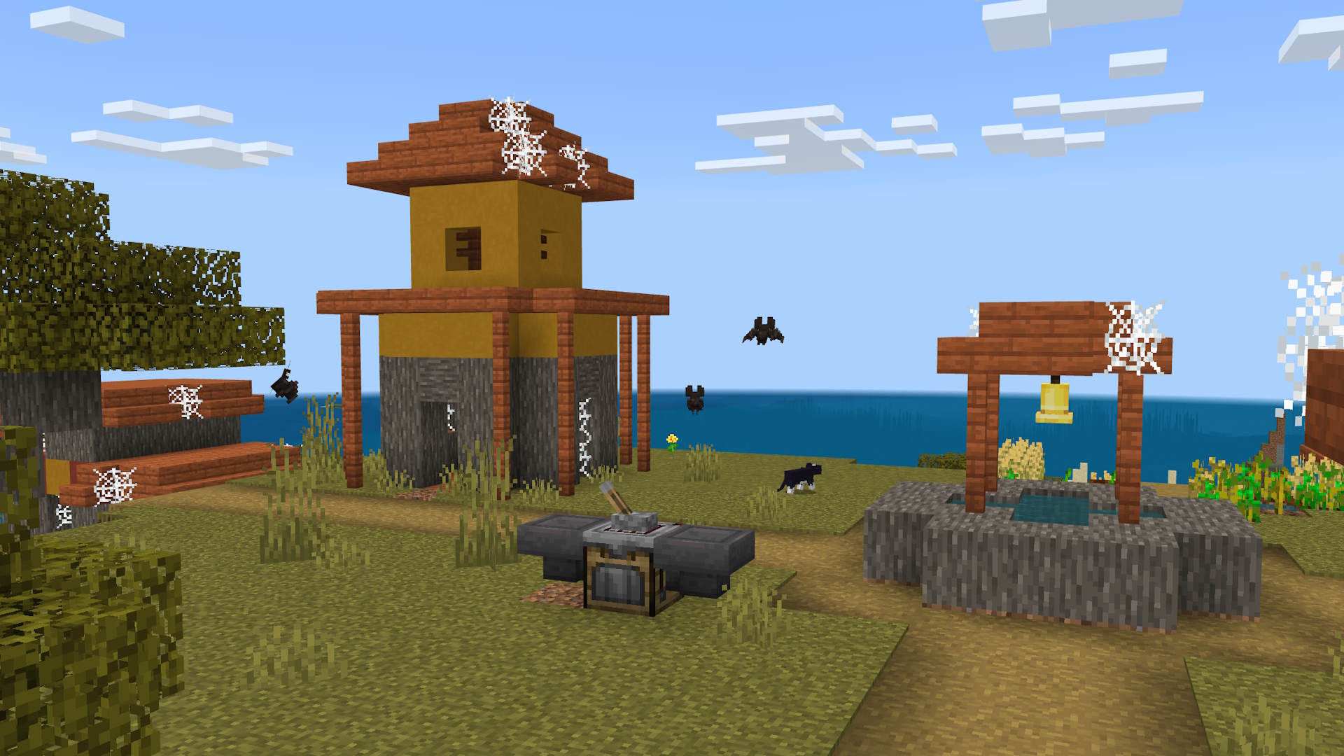 A Minecraft screenshot of am abandoned village. There are bats flying around, and there's a crafter in the scene.