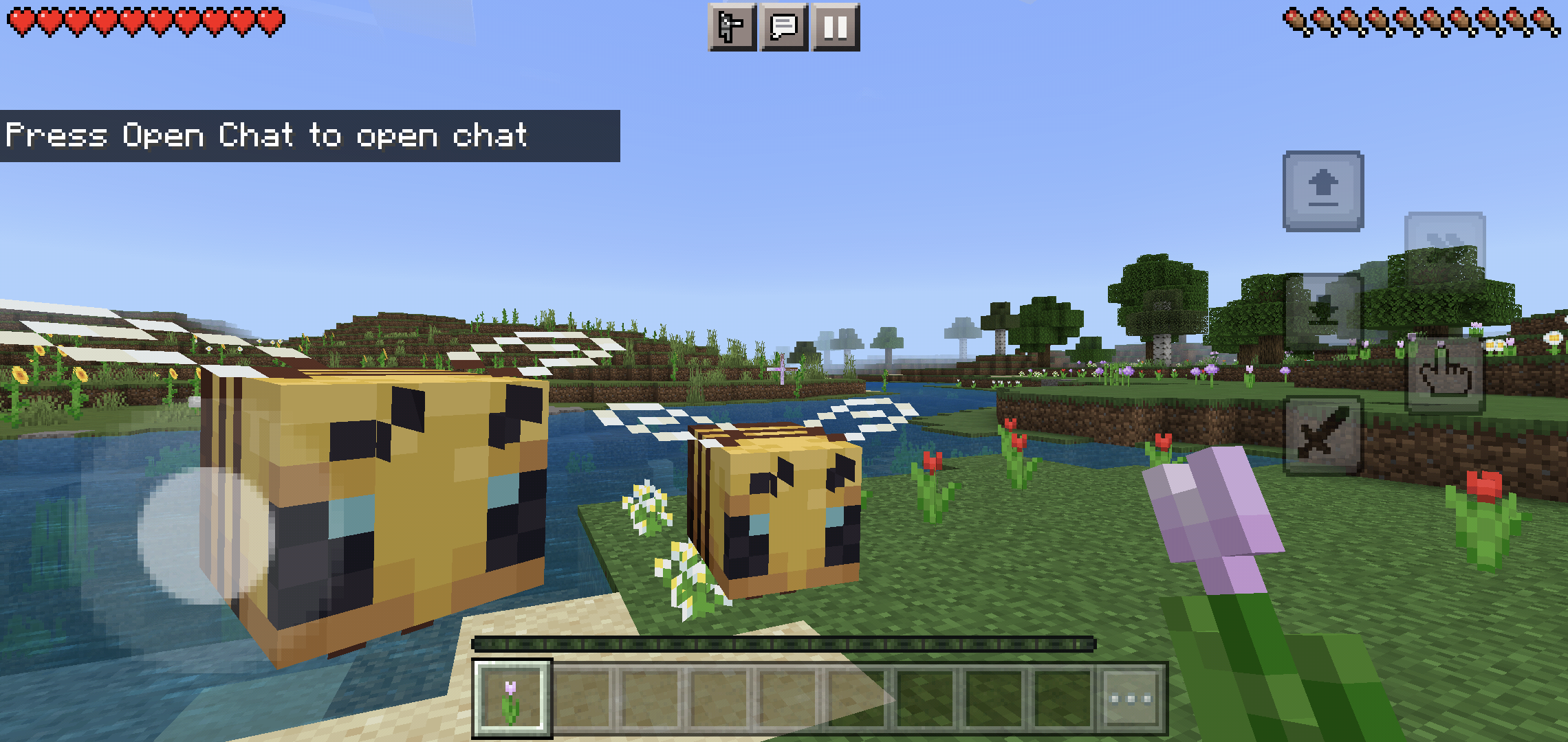 Uma captura de tela do Minecraft mostrando os controles de toque móveis atualizados